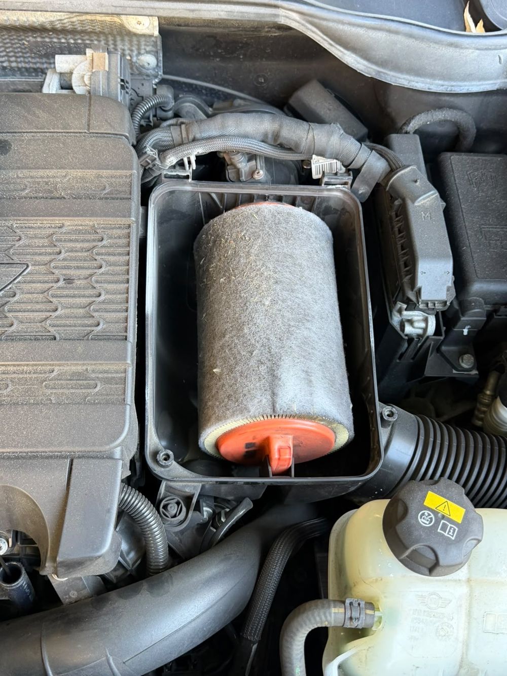 Clogged engine air filter removed from the airbox